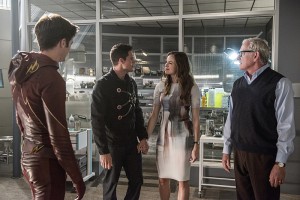 The Flash -- "The Man Who Saved Central City" -- Image FLA201b_0084b -- Pictured (L-R): Grant Gustin as Barry Allen/ The Flash, Robbie Amell as Ronnie, Danielle Panabaker as Caitlin Snow and Victor Garber as Professor Stein -- Photo: Cate Cameron /The CW -- é 2015 The CW Network, LLC. All rights reserved