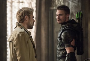 Arrow -- "Haunted" -- Image AR404B_0351b.jpg -- Pictured (L-R): Matt Ryan as Constantine and Stephen Amell as The Arrow -- Photo: Cate Cameron/ The CW -- é 2015 The CW Network, LLC. All Rights Reserved.