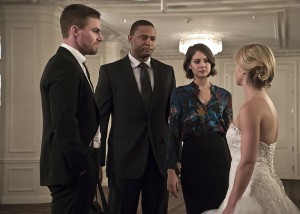 Arrow -- "Broken Hearts" -- Image AR416a_0300b.jpg -- Pictured (L-R): Stephen Amell as Oliver Queen, David Ramsey as John Diggle, Willa Holland as Thea Queen and Emily Bett Rickards as Felicity Smoak -- Photo: Katie Yu/The CW -- é 2016 The CW Network, LLC. All Rights Reserved.