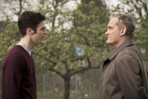 The Flash -- " The Runaway Dinosaur" -- Image: FLA221b_0014b.jpg -- Pictured (L-R): Grant Gustin as Barry Allen and John Wesley Shipp as Henry Allen -- Photo: Katie Yu/The CW -- é 2016 The CW Network, LLC. All rights reserved.