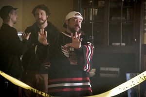 The Flash -- " The Runaway Dinosaur" -- Image: FLA221a_bts_0305b.jpg -- Pictured: Behind the scenes with Kevin Smith -- Photo: Katie Yu/The CW -- é 2016 The CW Network, LLC. All rights reserved.