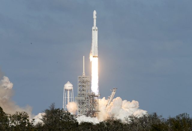 A SpaceX Falcon Heavy rocket lifts off from the Kennedy Space Center in Cape Canaveral