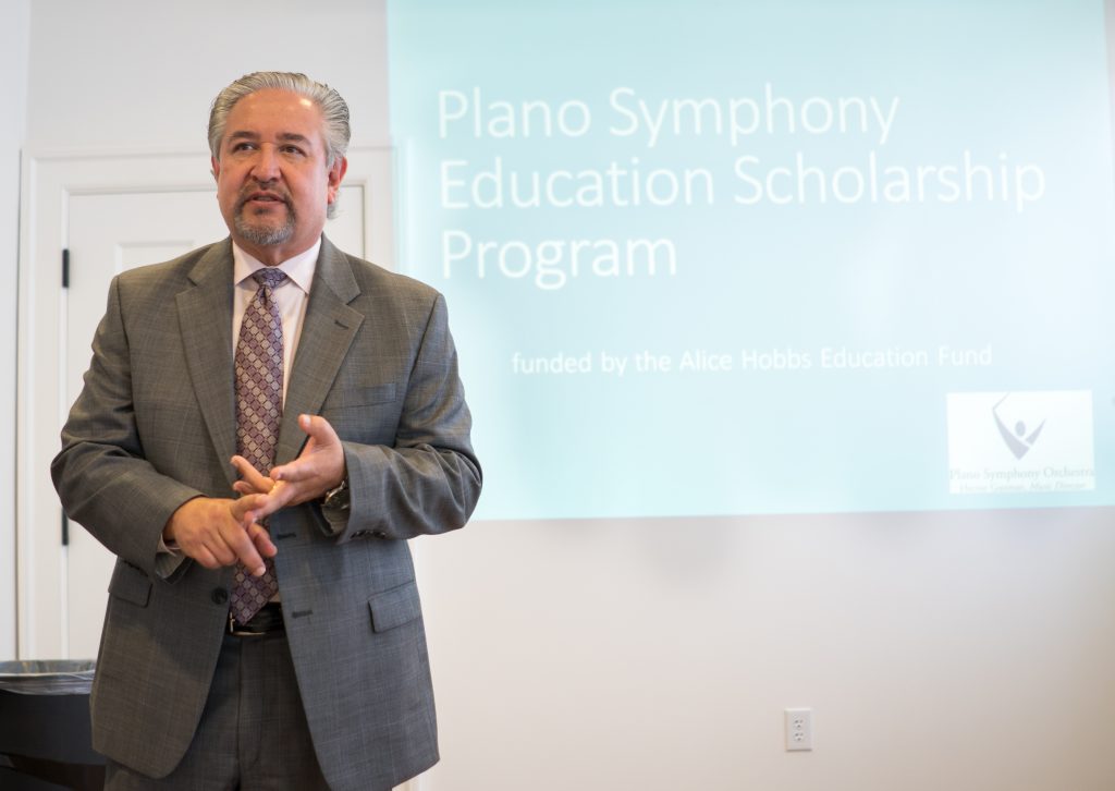 Maestro Hector Guzman tells the crowd at the press release how scholarships helped him throughout his music education.