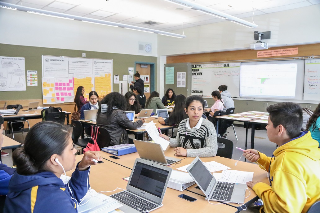 Students work together in a group at the start of class. Students work together in a group at the start of class.