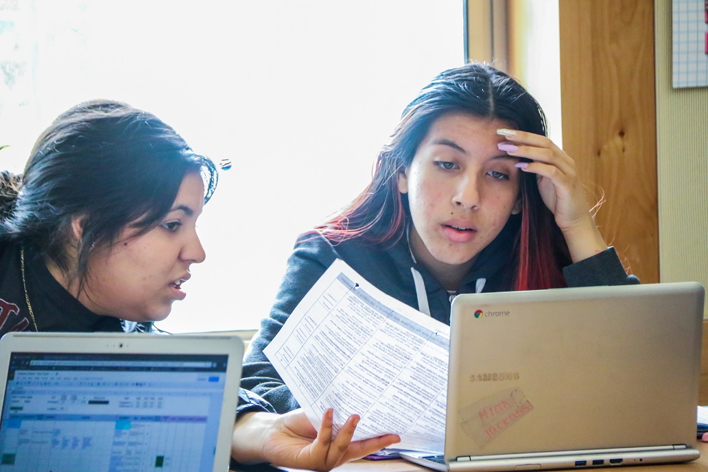 This photo shows two students working together during peer grading. This photo shows two students working together during peer grading.