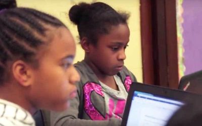 Photo of two students working at table