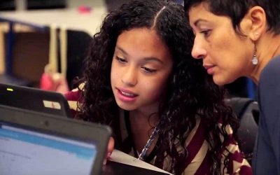 Photo of teacher and student working together