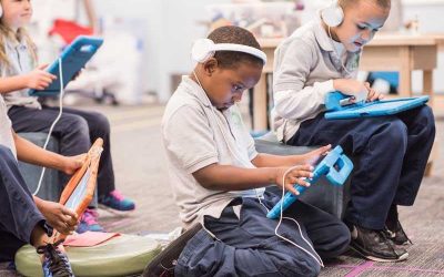 Photo of multiple students working on tablet devices