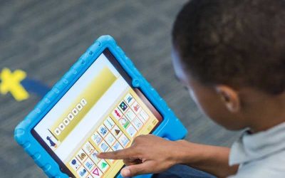 Photo closeup of student working on tablet device