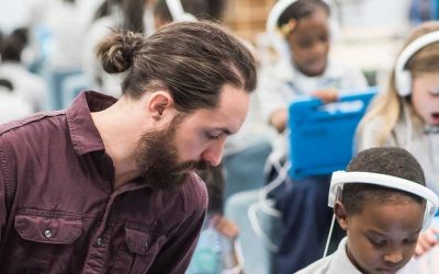 Photo of teacher and student discussing content