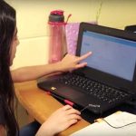 Photo of student working on her laptop