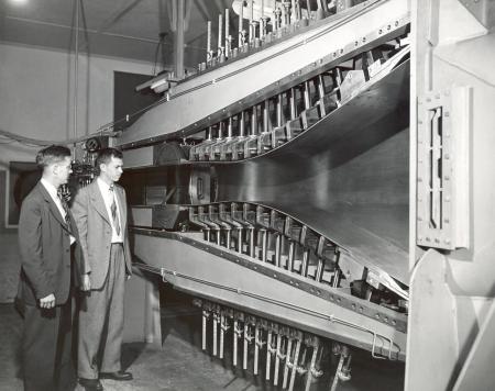 JPL engineer Dalton Bergan (at left) and Allen E. Puckett with JPL's 12" supersonic wind tunnel in an undated photo. Puckett JPL supersonic wind tunnel