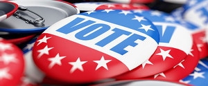 An image of red, white, and blue buttons reading "vote."