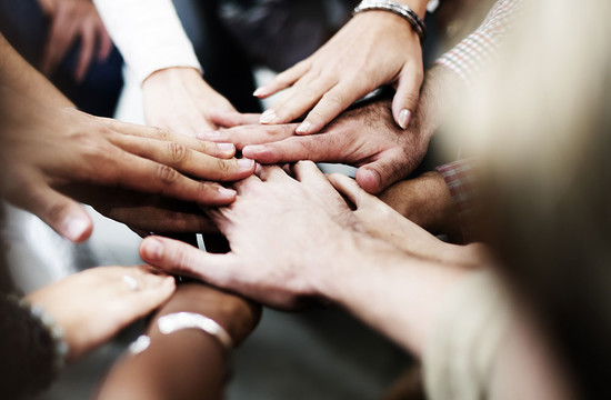 photo of many hands together