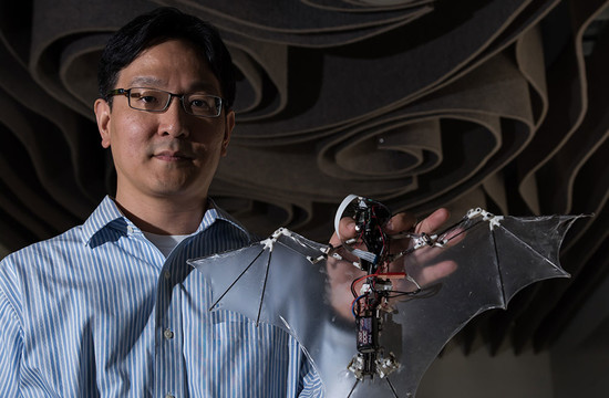 photo of Soon-Jo Chung holding a mechanical bat