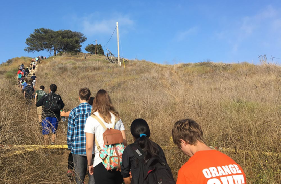 Caltech freshman hike up a hill during a geology hike as part of Frosh Camp.