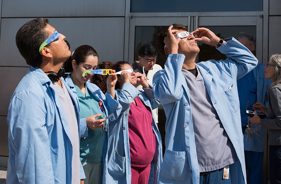 photo of Caltech staff outside to view the eclipse