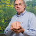 Richard Andersen holding a model of a brain.