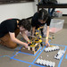 At the 2016 Science Olympiad event at Caltech, participants from Canyon Crest Academy set up a robotic arm.