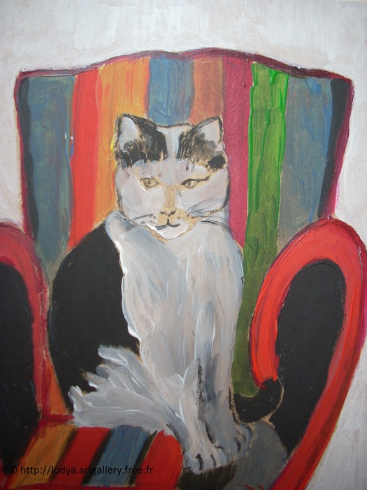 THE CAT ON THE ARMCHAIR