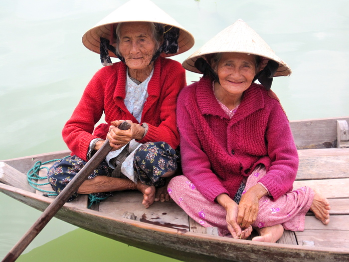 Two Vietnamese ladies rowing