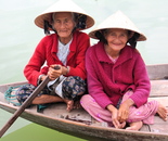 Two Vietnamese ladies rowing