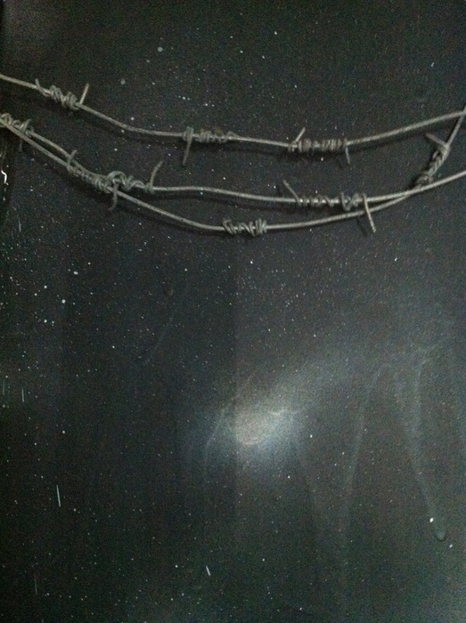 A horizontal arrangement of wire over black