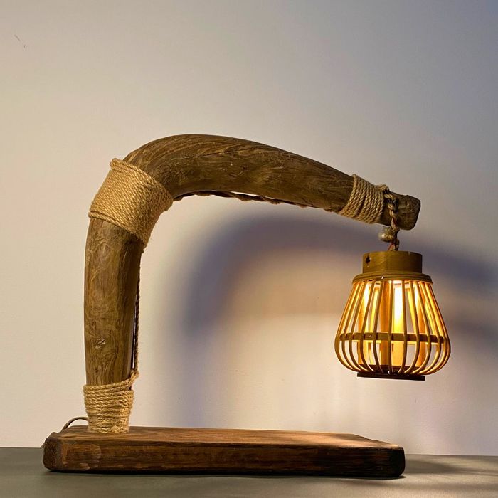 The Plowman‘s Lantern — Sculptural Table Lamp in Reclaimed Ox Yoke & Rattan