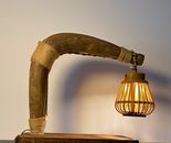 The Plowman‘s Lantern — Sculptural Table Lamp in Reclaimed Ox Yoke & Rattan
