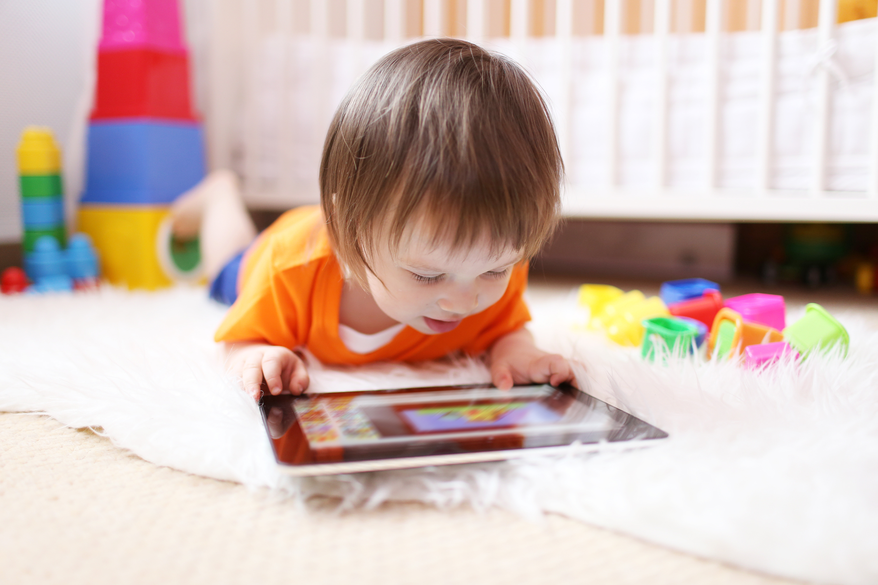 lovely little boy with tablet computer at home