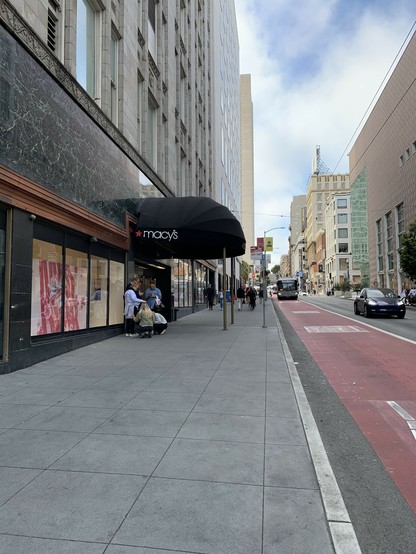 The Stockton sidewalk fronting Macy’s. Wide open empty space. Plenty of room for bike racks. But there are none