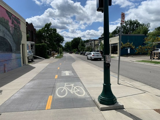 two way sidewalk level bike lanes