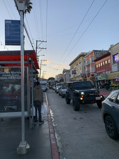 22 bus stuck behind hella cars approaching the BART stop