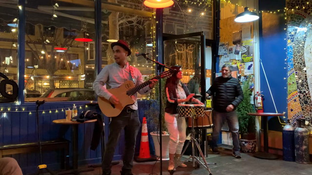A meringue performance with guitar and hand drums