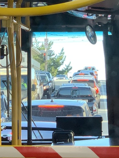Nine cars are in front of the bus I’m on, waiting to turn left