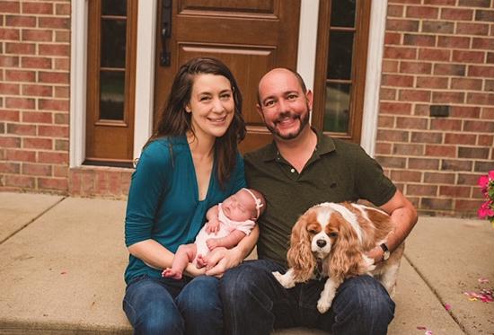 Adoptive-family-posing-with-baby