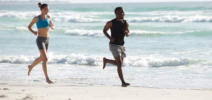 couple-jogging-on-beach