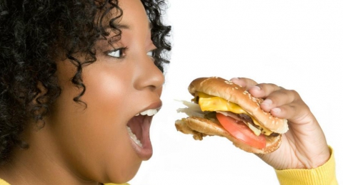 0-759324407-black-woman-eating