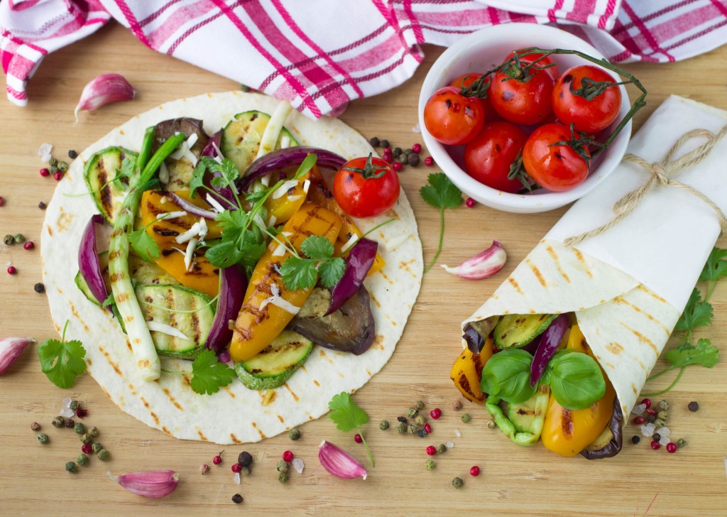 Tortilla and grilled vegetables - zucchini, eggplant, bell peppers, red onions, tomatoes and herbs