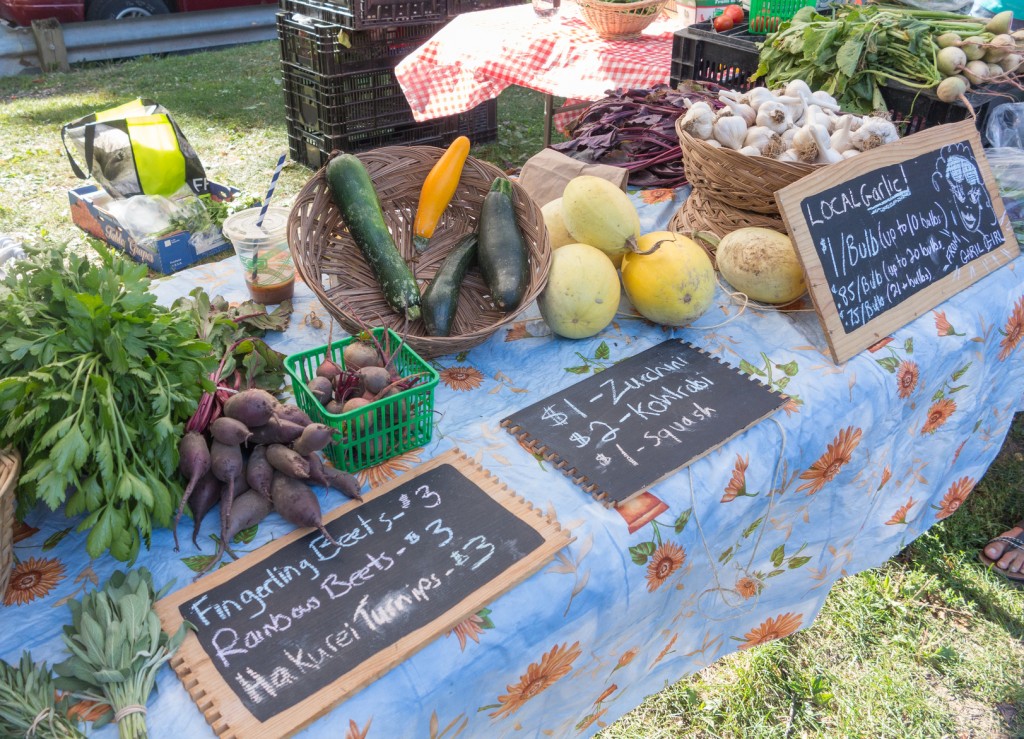 Display of local produce at outdoor farmers' market