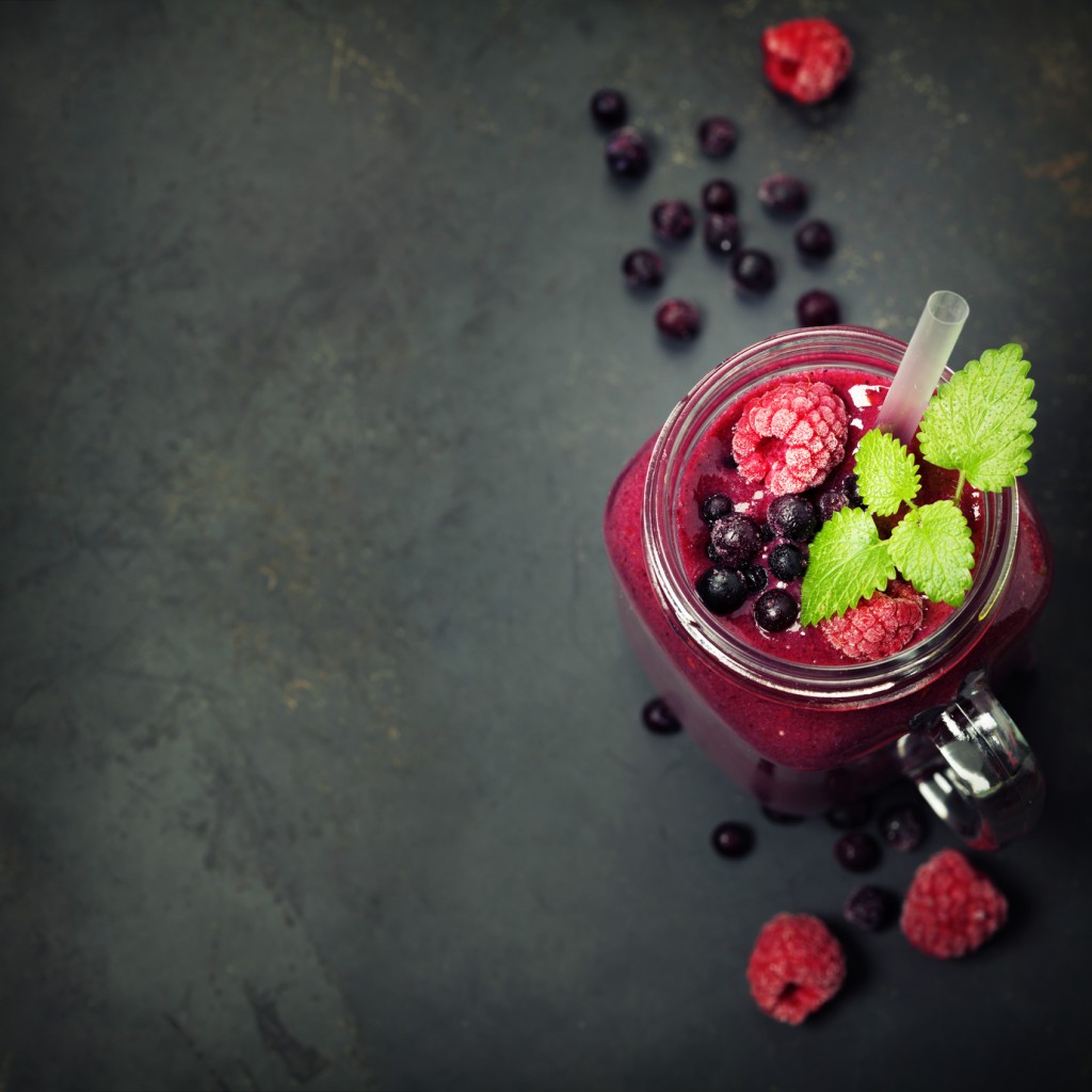 Berry smoothie on rustic background - Healthy eating, Detox or Diet concept