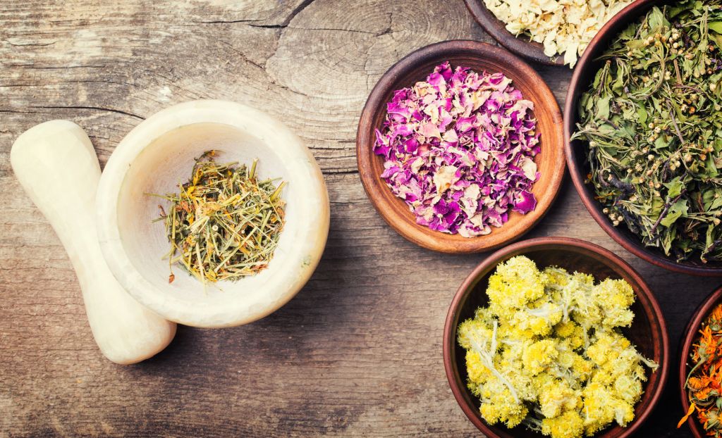 Nature medicine . Herbs on wooden background .