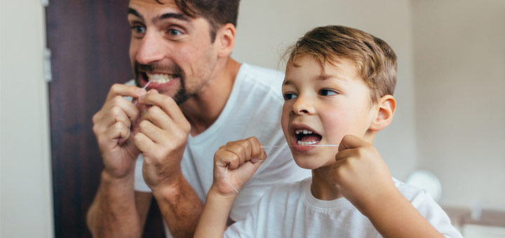 father-and-son-flossing