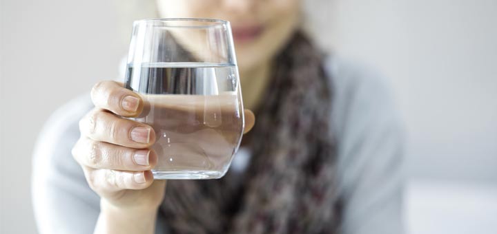 woman-holding-water-glass