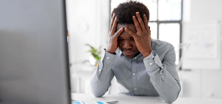 black-man-anxiety-at-desk