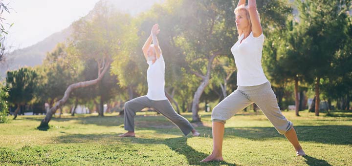 elderly-couple-yoga-park