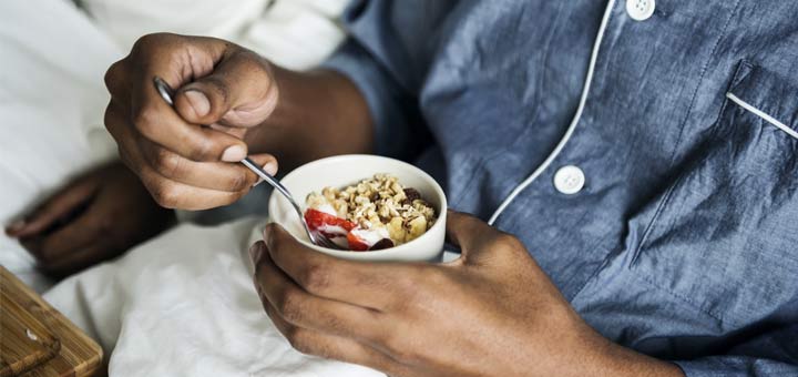 black-man-eating-oatmeal-in-bed