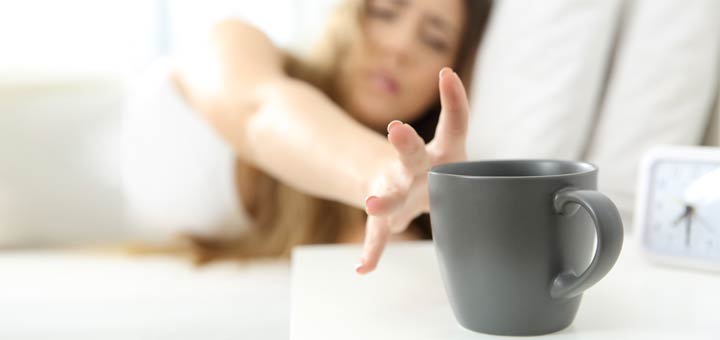 sleepy-woman-reaching-for-coffee
