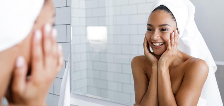 beautiful-black-girl-looking-in-bathroom-mirror