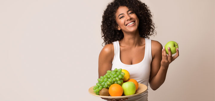 black-woman-holding-fruit-plate